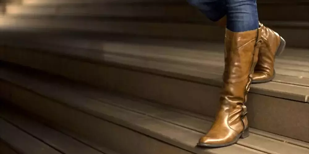 walking stairs in cowboy boots